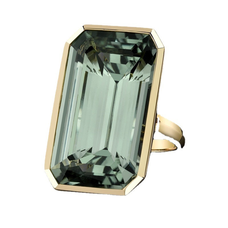 Golden Ring With A Green Square Zircon Inlay